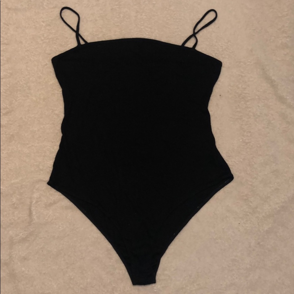 Black, straight-lined, knit body suit